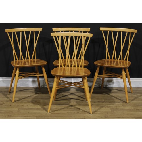 102 - A set of four Ercol candlestick dining chairs, 79cm high, 46cm wide, the seat 41.5cm wide and 34cm d... 