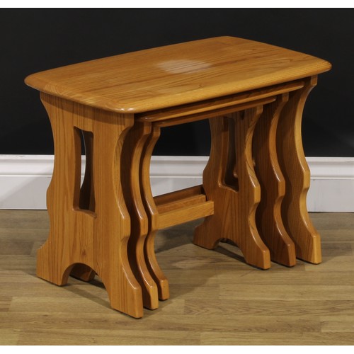 104 - An Ercol Chantry nest of three occasional tables, the largest 42cm high, 57cm wide, 35.5cm deep