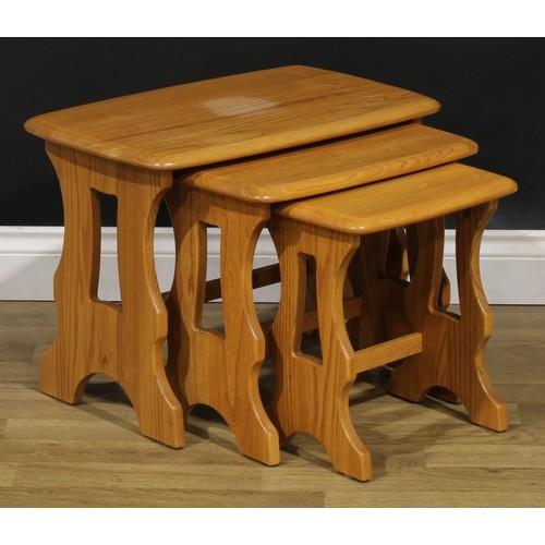 104 - An Ercol Chantry nest of three occasional tables, the largest 42cm high, 57cm wide, 35.5cm deep