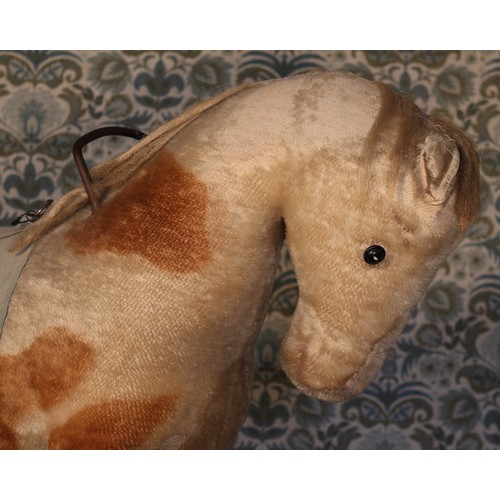 6095 - A large straw-filled cream and brown mohair ride-on or push along Horse on wheels, felt saddle, pull... 