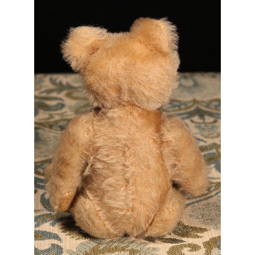 6100 - A 1950's Steiff (Germany) blonde mohair jointed miniature teddy bear, brown and black plastic eyes, ... 