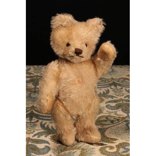 6100 - A 1950's Steiff (Germany) blonde mohair jointed miniature teddy bear, brown and black plastic eyes, ... 