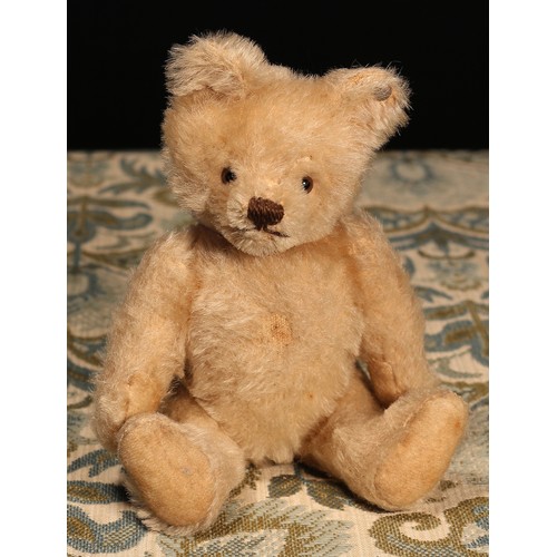 6100 - A 1950's Steiff (Germany) blonde mohair jointed miniature teddy bear, brown and black plastic eyes, ... 