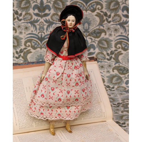 6119 - A mid 19th century painted papier-mâché shoulder head doll, the papier-mâché head with black moulded... 