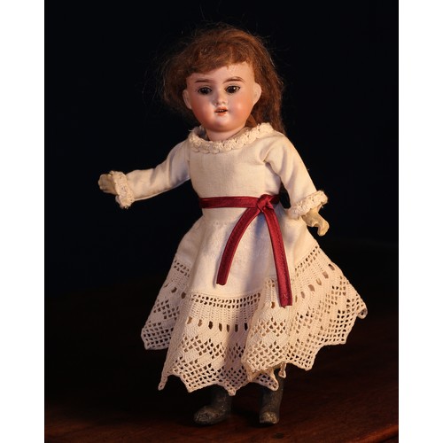 6121 - An Armand & Marseille (Germany) bisque head and painted composition bodied doll, the bisque head wit... 