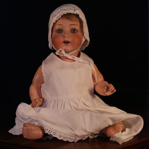 6123 - An Armand & Marseille (Germany) bisque head and painted composition bodied doll, the bisque head wit... 