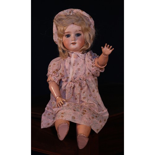 6125 - An Armand & Marseille (Germany) bisque head and ball jointed painted composition bodied doll, the bi... 