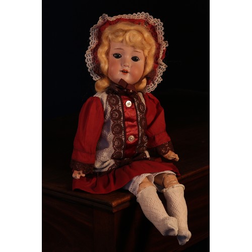 6135 - An Armand & Marseille (Germany) bisque head and painted composition bodied doll, the bisque head wit... 