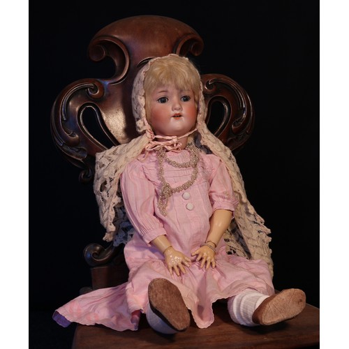 6138 - An Armand & Marseille (Germany) bisque head and ball jointed painted composition bodied doll, the bi... 