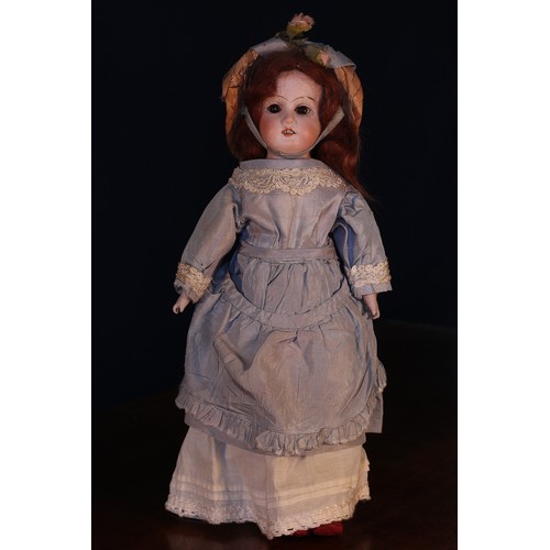 6139 - A German bisque shoulder head doll, the bisque head inset with fixed brown glass eyes, painted featu... 