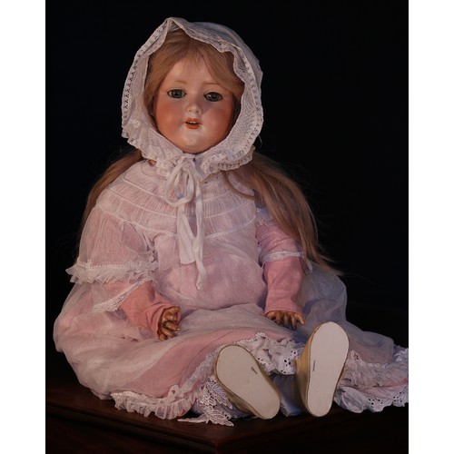 6144 - An Armand & Marseille (Germany) bisque head and ball jointed painted composition bodied doll, the bi... 