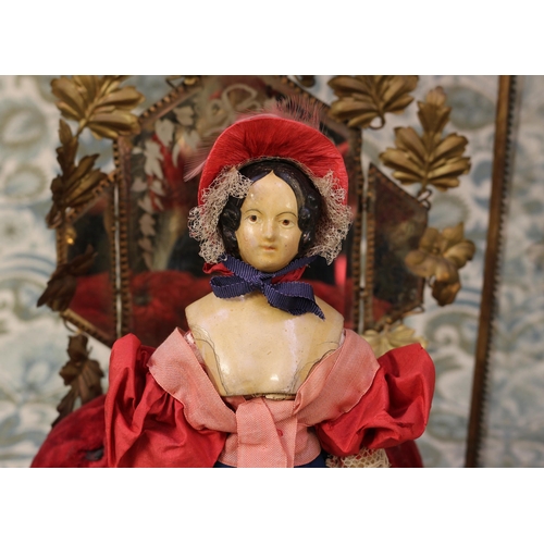 6149 - A mid 19th century painted papier-mâché shoulder head doll, the papier-mâché head with black moulded... 