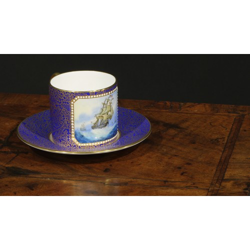 10 - A Lynton porcelain cabinet coffee can and stand, painted by Stefan Nowacki, signed, with a Dutch shi... 