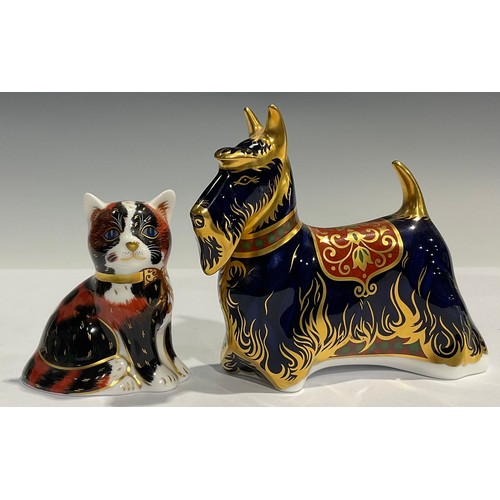 12 - A Royal Crown Derby paperweight, Scottish Terrier, gold stopper; another, Calico Kitten, gold stoppe... 