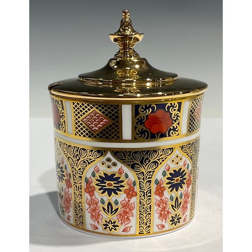 19 - A Royal Crown Derby Imari 1128 pattern cylindrical preserve pot, gilt metal cover with finial, 10.5c... 