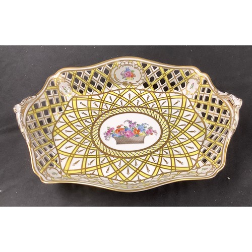 66 - A Dresden oval pierced basket, the central cartouche painted with a basket of summer flowers, within... 