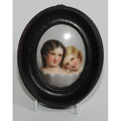 68 - A 19th century Continental porcelain oval plaque, painted with a pair of children, 8cm x 6cm