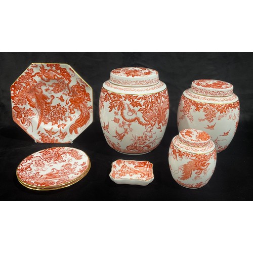 84 - A set of three Royal Crown Derby Red Aves pattern graduated ovoid Ginger Jars and covers, 21cm, 18cm... 