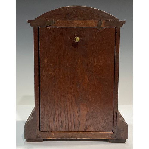 130 - An oak cased mantel clock, Camerer Cuss and Co, London, Roman numerals on silvered chapter ring, 23.... 