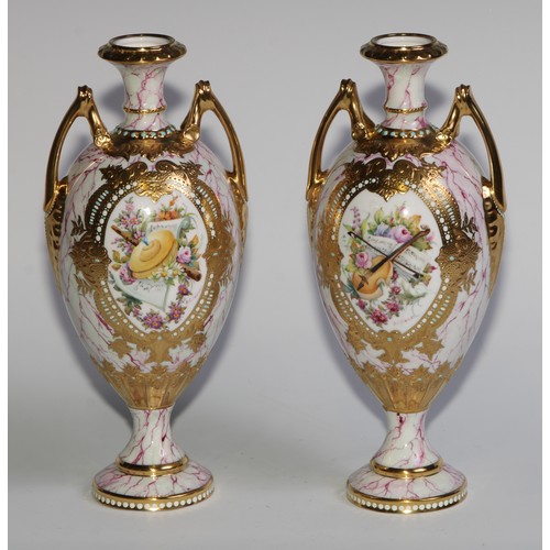 138 - A pair of Lynton porcelain ovoid vases, painted by Stefan Nowacki, signed, with musical trophies and... 