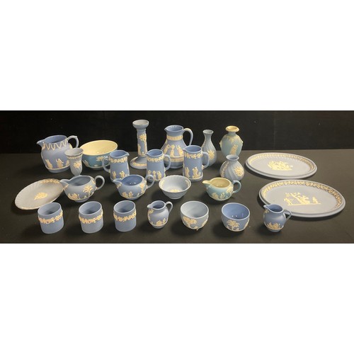 143 - A quantity of Wedgwood blue jasperware including candlestick, jugs, vases, oval dishes, etc, qty
