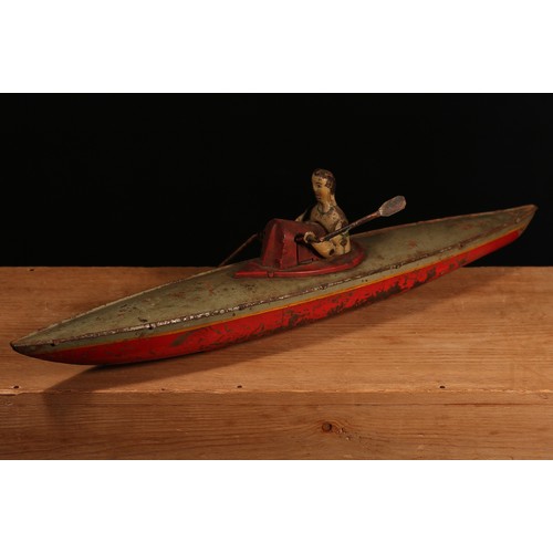 6161 - An early 20th century German tinplate and clockwork rowing boat, fitted with a lone oarsman figure w... 