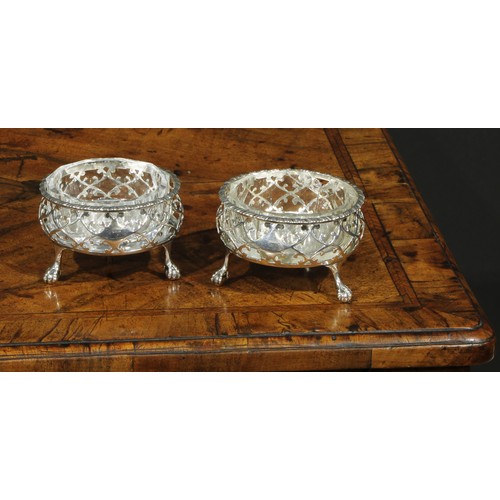168 - A pair of large early George III silver salts, gadrooned and pierced borders, ball and claw feet, as... 