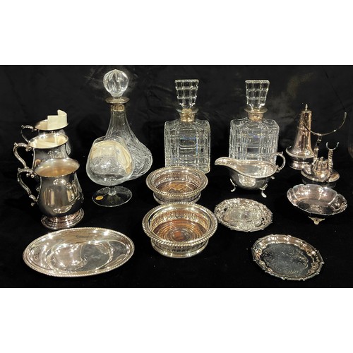 170 - A silver mounted cut glass ship's decanter, London 1989; a pair of silver mounted cut glass decanter... 