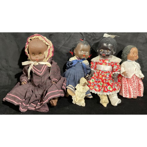 266 - Toys & Juvenalia - a Pedigree hard plastic black doll, 33cm high; other black dolls (5)