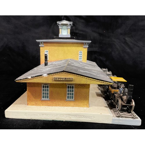 276 - A miniature model train station, Gettysburg, complete with train and coaches, 28cm wide; a Japanese ... 