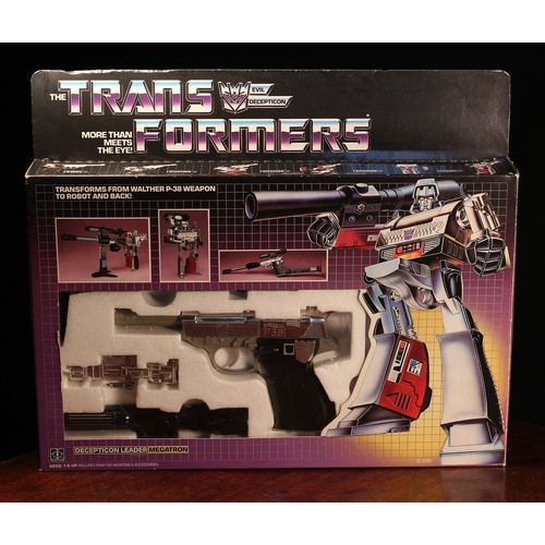 6184 - A Hasbro Transformers Decepticon Leader Megatron set, comprising snap-on weapons and accessories, wi... 