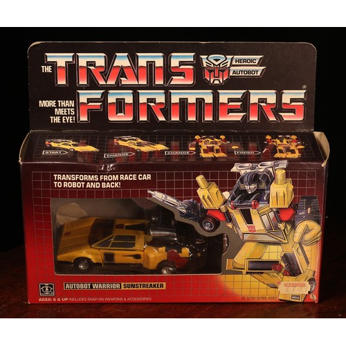 6186 - A Hasbro Transformers Autobot Warrior Sunstreaker, comprising snap-on weapons and accessories, windo... 