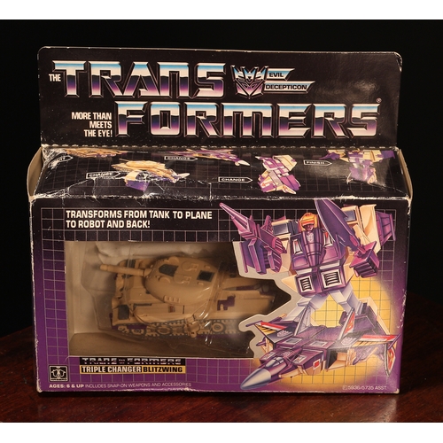 6188 - A Hasbro Transformers Triple Changer Blitzwing, comprising snap-on weapons and accessories, window b... 