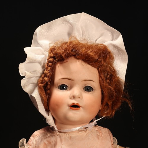 6199 - A Carl Harmus (Germany) bisque head and painted composition bodied doll, the bisque head with weight... 