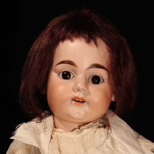 6249 - An Armand & Marseille (Germany) bisque head and ball jointed painted composition bodied doll, the bi... 