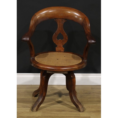 106 - A late Victorian/Edwardian swivel desk chair, 85cm high, 63cm wide, the seat 43cm wide and 42cm deep