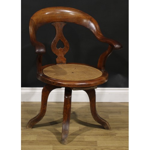 106 - A late Victorian/Edwardian swivel desk chair, 85cm high, 63cm wide, the seat 43cm wide and 42cm deep