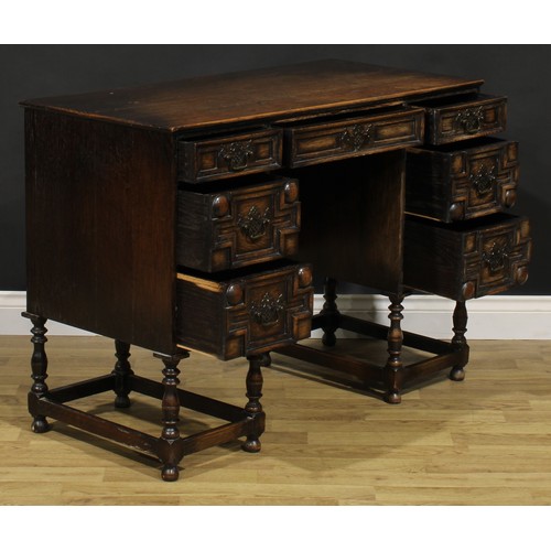 109 - A Charles II inspired oak desk, rectangular top above an arrangement of drawers, 77.5cm high, 106.5c... 