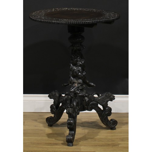 111 - An early 20th century Anglo-Indian hardwood tripod occasional table, 74.5cm high, 54.5cm diameter