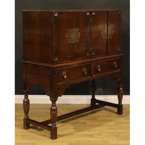 112 - A Charles II and Queen Anne inspired oak side cabinet, 133.5cm high, 123cm wide, 52.5cm deep