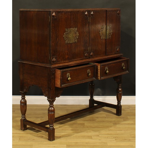 112 - A Charles II and Queen Anne inspired oak side cabinet, 133.5cm high, 123cm wide, 52.5cm deep