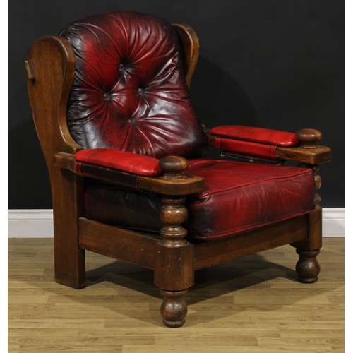 207 - An Arts & Crafts style oak lambing inspired chair, 99cm high, 83cm wide, the seat 55cm wide and 57cm... 