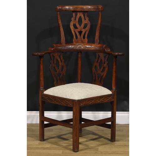 211 - A George III Revival beech, ash and elm corner chair, 117cm high, 79cm wide, the seat 43cm square