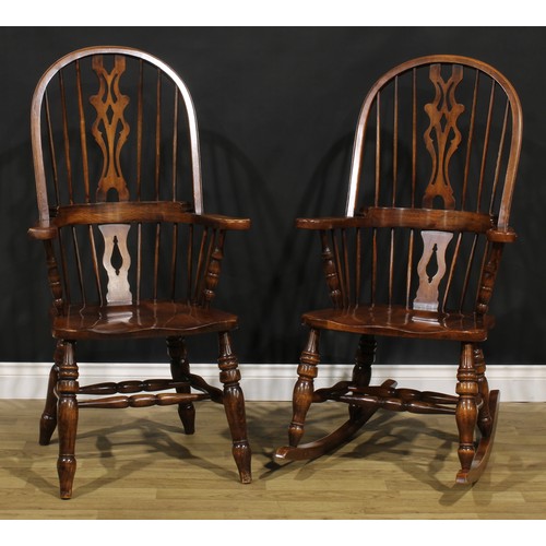 A beech hoop back Windsor rocking chair, 115.5cm high, 63.5cm wide, the