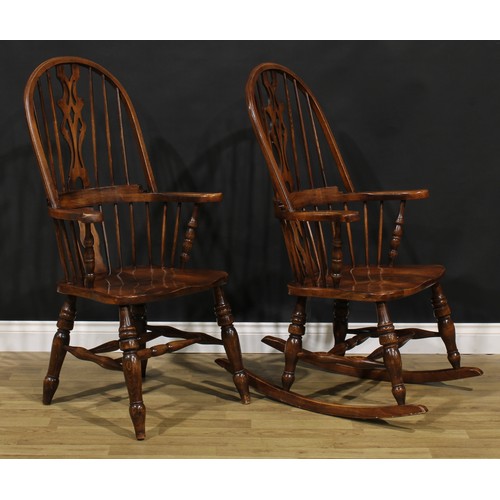 A beech hoop back Windsor rocking chair, 115.5cm high, 63.5cm wide, the