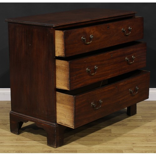 1248 - A George III mahogany chest, oversailing top above three long graduated drawers, brass swan neck han... 