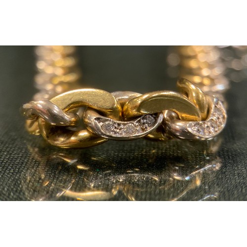 96 - A diamond accented fancy Gucci link two tone 18ct gold bracelet, interlocked links set with fifty si... 