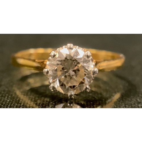 105 - A diamond solitaire ring, round brilliant cut diamond measuring approx 6.9mm x 6.9mm x 4.5mm, calcul... 