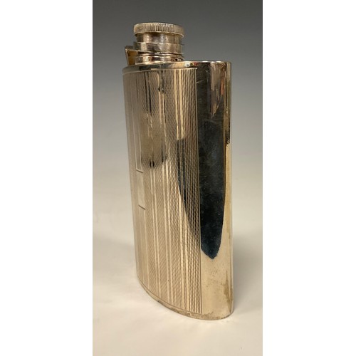 57 - An Art Deco style silver curved rounded rectangular hip flask, engine turned in bands, hinged bayone... 