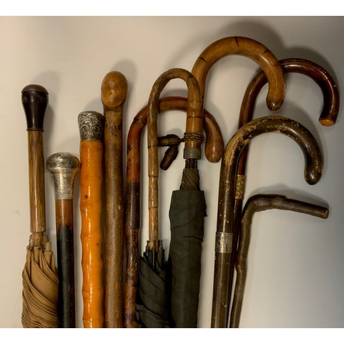 958 - Walking Sticks & Umbrellas - a Victorian silver mounted walking stick, two others , all marks worn; ... 